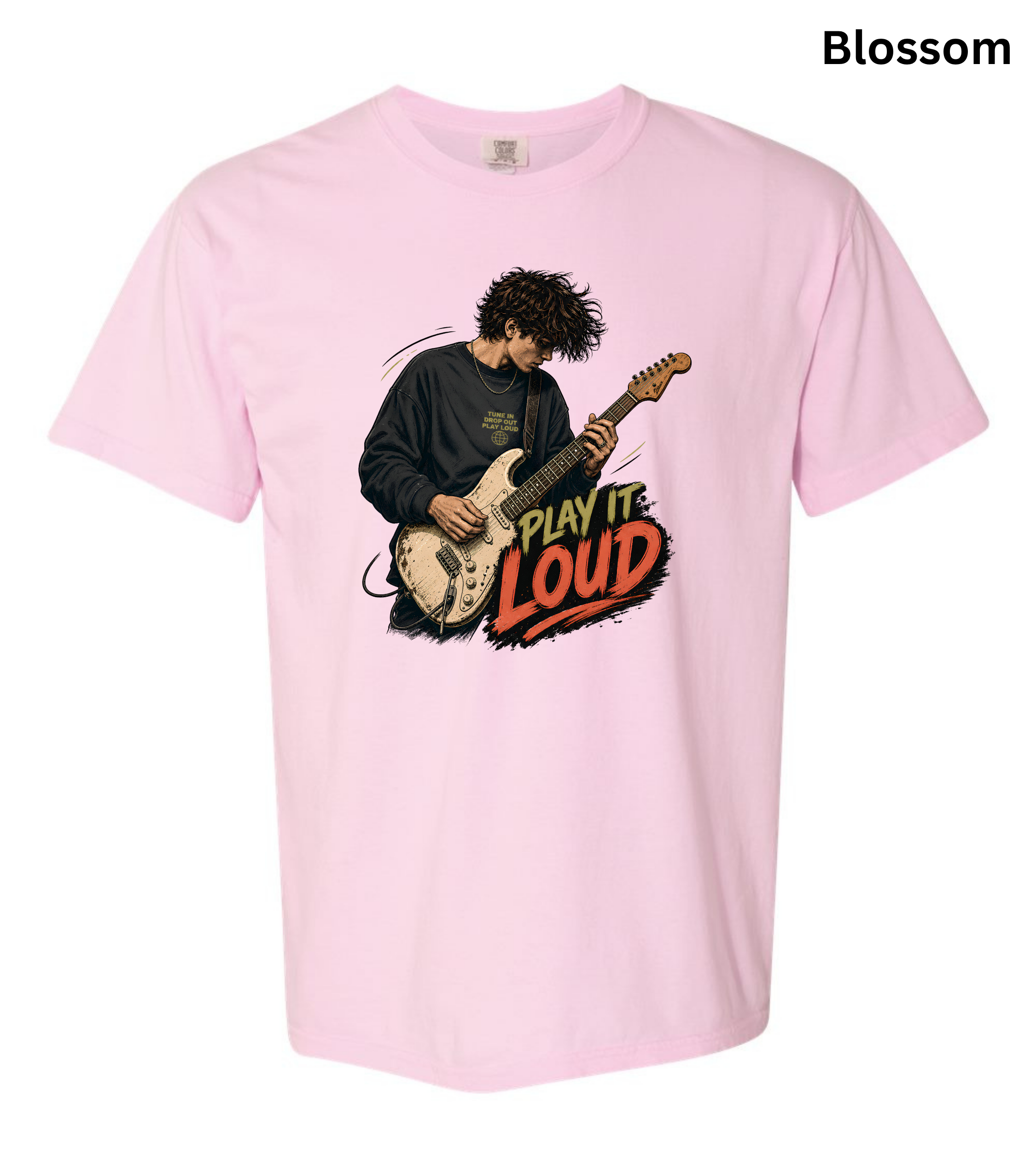 A light pink short-sleeve t-shirt with a graphic of a guitarist playing an electric guitar next to the text 'PLAY IT LOUD' in red and yellow. The word 'Blossom' is printed in black in the top right corner.