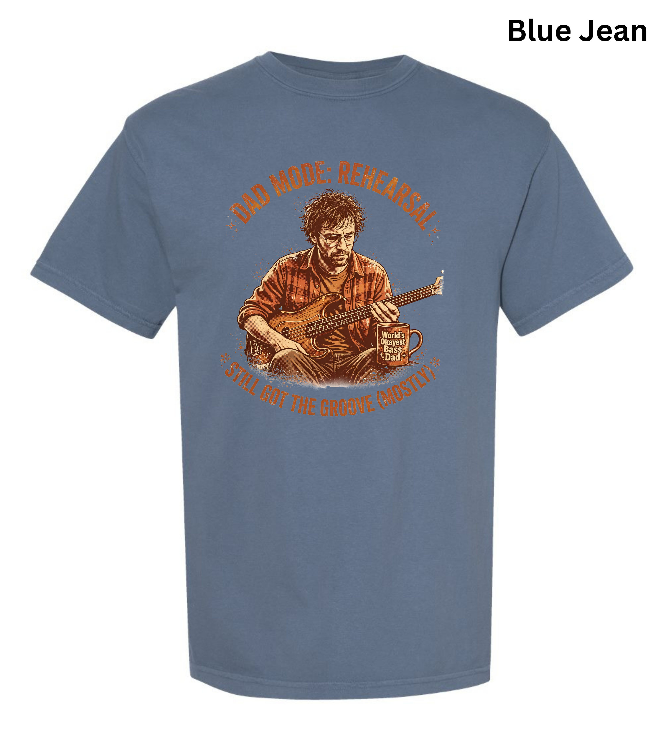 A blue short-sleeve graphic t-shirt on a white background, featuring a vintage-style illustration of a man playing an acoustic guitar with the text 'AND MADE NEWARK! I'LL BE BY THE GATESHIRE COASTAL'. A 'Blue Jean' color label is visible in the top right corner.