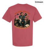 A short-sleeve crewneck t-shirt in a vibrant crimson color, featuring a large graphic print of a man playing an electric guitar surrounded by music equipment. The graphic includes the text 'DAD MODE - RESEARCH' at the top and 'I'LL GOT THE GROOVE (MUST!)' at the bottom.