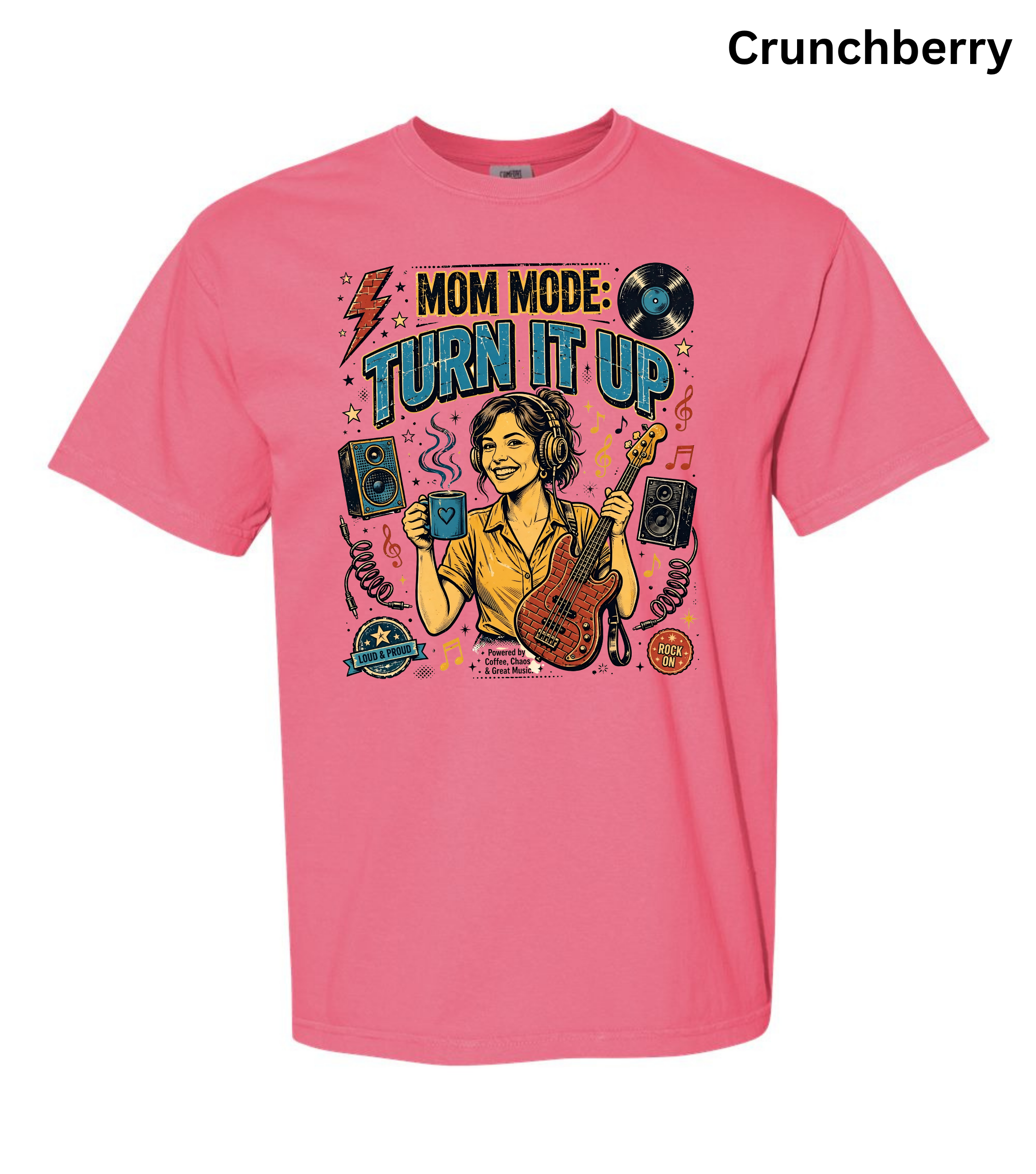 A pink short-sleeve graphic t-shirt featuring a colorful illustration of a woman playing an electric guitar with the text 'MOM MODE: TURN IT UP'. The word 'Crunchberry' is printed in black at the top right corner.