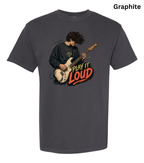 A dark gray short-sleeve t-shirt with a graphic of a guitarist playing an electric guitar next to the text 'PLAY IT LOUD' in red, orange, and yellow. The word 'Graphite' is printed in black in the top right corner.