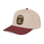 Beige and green cap with a plaid skull design and text on a white background