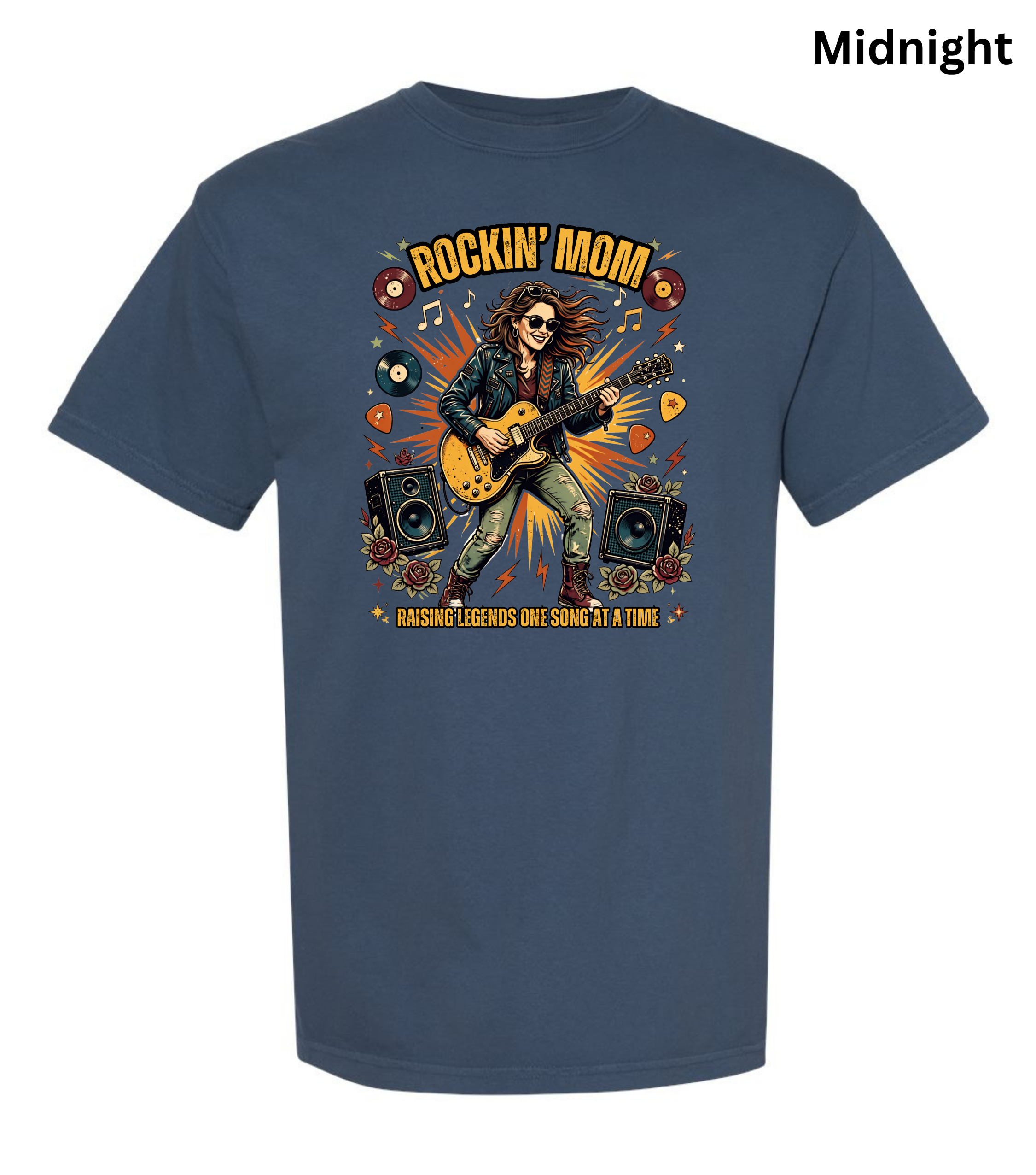 A navy blue short-sleeve t-shirt with a colorful graphic print on the front featuring a rock star playing an electric guitar, speakers, vinyl records, and the text 'ROCKIN' MOM' and 'RAISING LEGENDS ONE GUITAR AT A TIME'. The word 'Midnight' is printed in the top right corner.