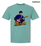 A seafoam green short-sleeve t-shirt with a graphic of a man playing an electric guitar and the text 'PLAY IT LOUD' printed on the front, shown against a plain white background.