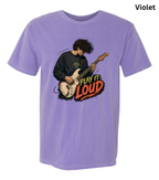 A light purple short-sleeve t-shirt with a graphic of a guitarist playing an electric guitar next to the text 'PLAY IT LOUD' in red, orange, and yellow. The word 'Violet' is written in black text in the top right corner.