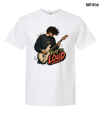 A white short-sleeve crewneck t-shirt featuring a graphic print of a guitarist playing an electric guitar with the text 'PLAY IT LOUD' in red, orange, and yellow. The word 'White' is printed in black in the top right corner.