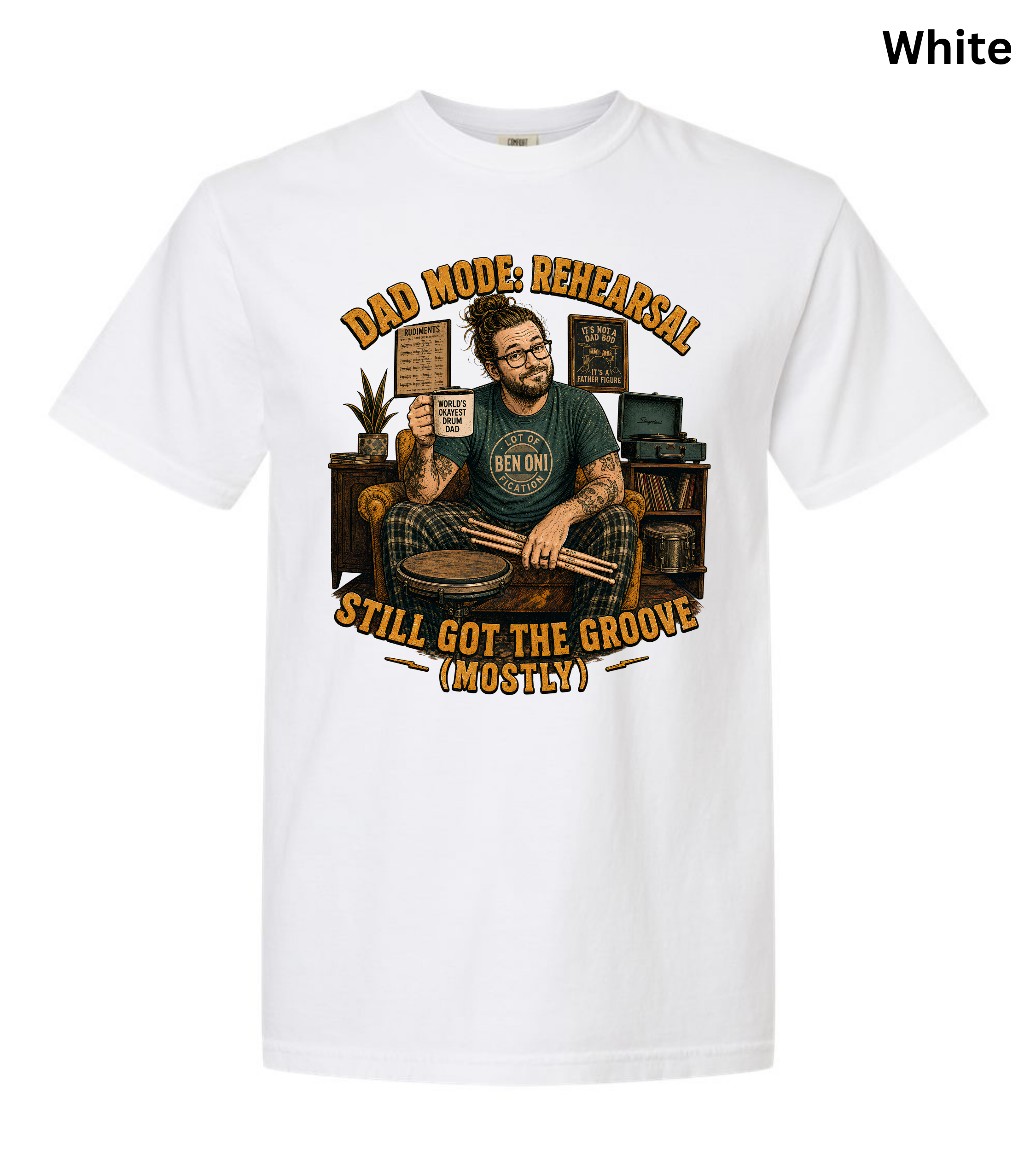 A white short-sleeve crewneck t-shirt with a vintage-style graphic on the front. The graphic features a man holding drumsticks in front of a drum kit, surrounded by books and a plant, with the text 'DAD MOOD, REHEARSAL STILL GOT THE GROOVE (MOSTLY)'.