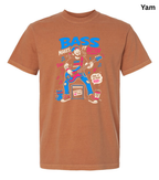 A heathered rust-orange crewneck t-shirt featuring a colorful graphic print of a bass player with the text 'BASS MAKES IT' and 'FEEL IT IN YOUR SOUL'.