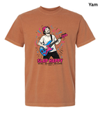 A rust-orange crewneck t-shirt featuring a colorful graphic of a man playing a blue and pink bass guitar with the text 'SLAP HAPPY' underneath, shown on a plain white background.