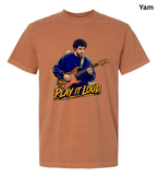 A rust-orange crewneck t-shirt featuring a graphic illustration of a man playing an electric guitar with the text 'PLAY IT LOUD' in yellow and black. The shirt is displayed on a clean white background with a 'Yam' label in the top right corner.