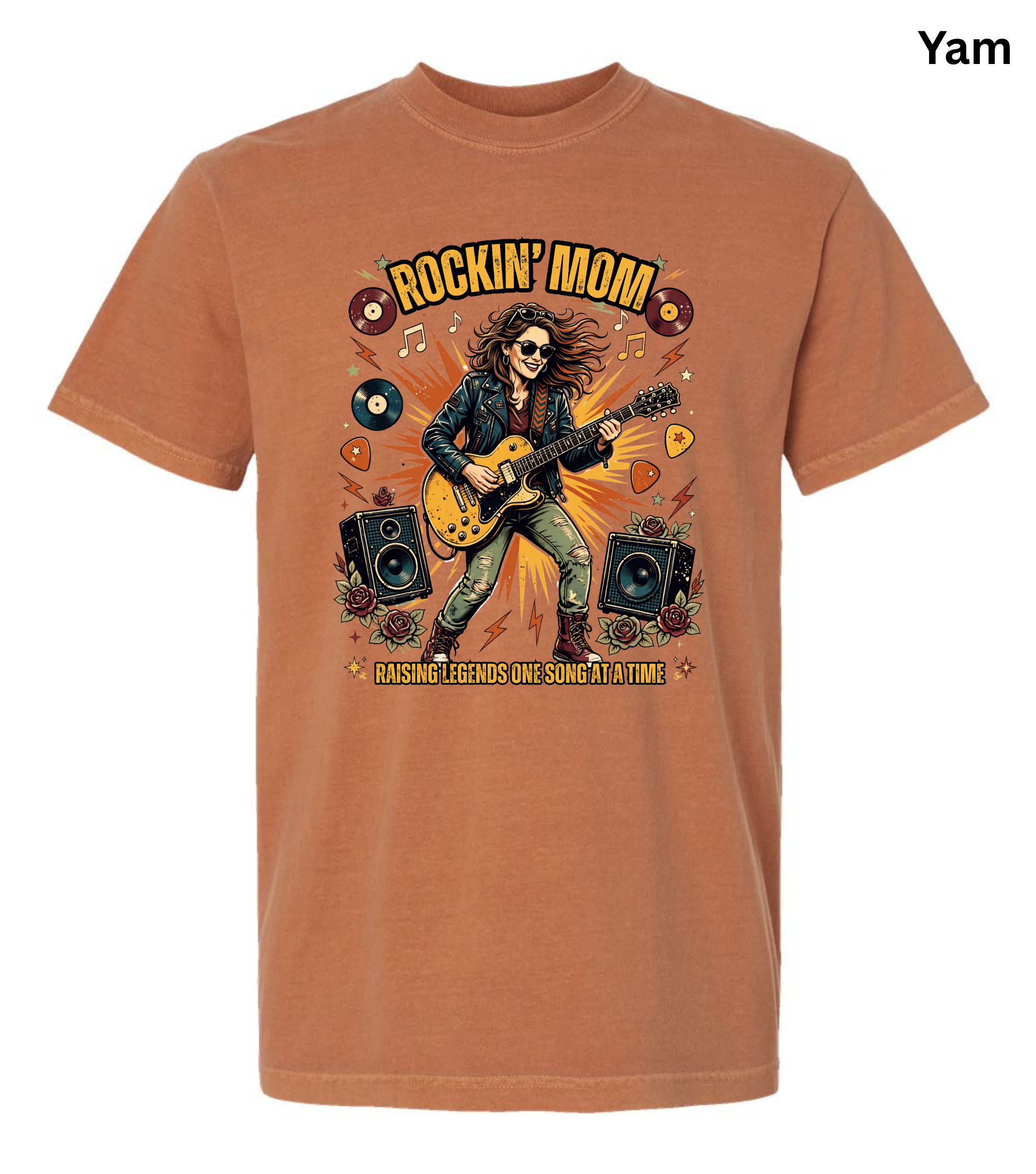 A heathered rust-orange crewneck t-shirt featuring a colorful graphic of a woman playing an electric guitar with the text 'ROCKIN' MOM' and 'CASHING LEADINGS ONE SONG AT A TIME'.