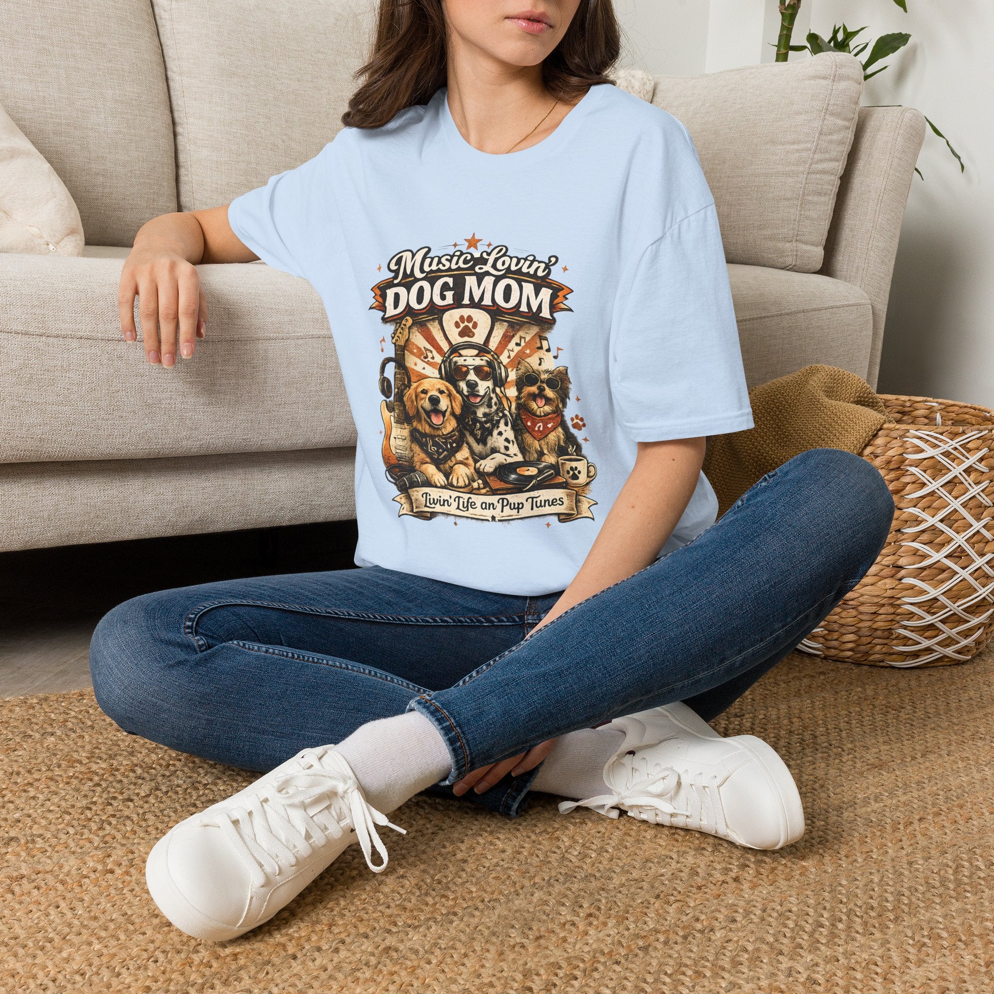 Person wearing a light blue t-shirt with 'Shroom Society' design sitting on the floor.