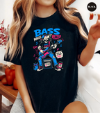 A woman wearing a black graphic t-shirt with a colorful cartoon illustration of a girl playing an electric guitar and the text 'BASS MAKES BETTER'.