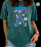 A person wearing a teal graphic t-shirt with a cartoon illustration of a man playing a guitar and the text 'BASS MAKES IT BETTER'. The background is solid black.