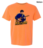 An orange short-sleeve crewneck t-shirt featuring a graphic print of a man playing an electric guitar with the text 'PLAY IT LOUD' underneath, shown against a plain white background.