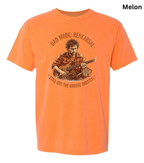 An orange short-sleeve crewneck t-shirt featuring a vintage-style graphic of a man playing a guitar, with the text 'DAD MODE: REHEARSAL' and 'STILL GOT THE GROOVE (MOSTLY)'.