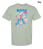 A light sage green crewneck t-shirt with a colorful graphic of a bass player and the text 'BASS MAKES IT BETTER' on the front, shown against a plain white background with a 'Bay' color label in the top right corner.