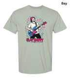 A light sage green t-shirt with a colorful graphic of a man playing an electric guitar, featuring the text 'SLAP HAPPY' and smaller text below. The word 'Bay' is printed in black in the top right corner.